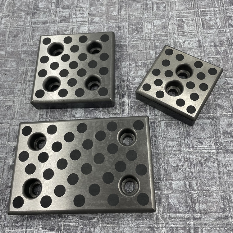 Self lubricating sliding plate